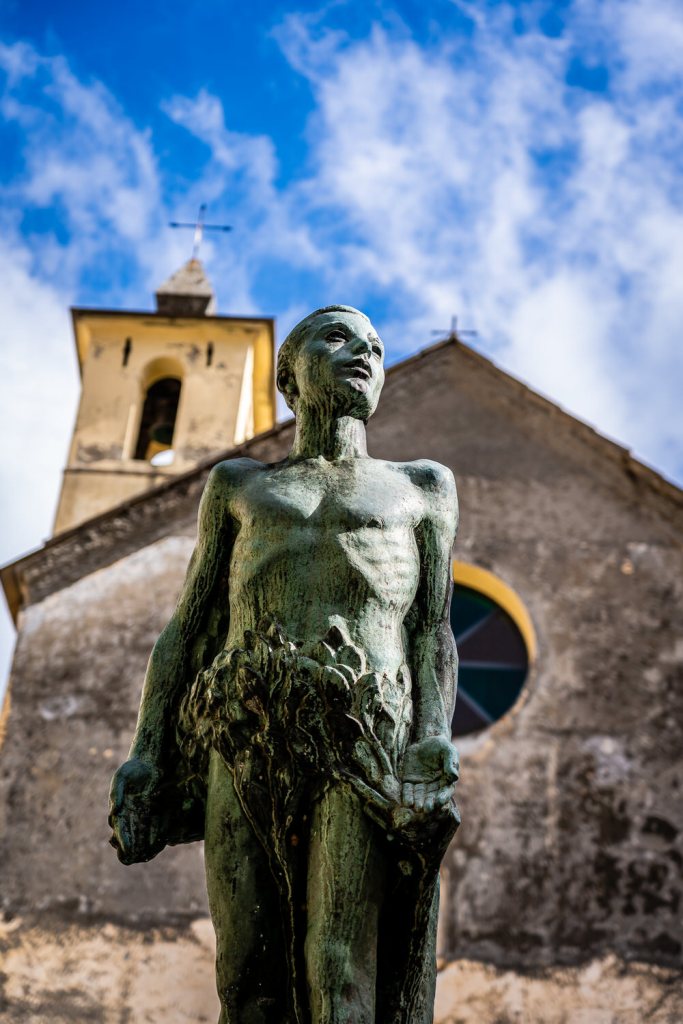 Memorial of the Fallen Statue in front of Capella dei Flagellati Chapel of Saint Catherine in Corniglia, Cinque Terre
